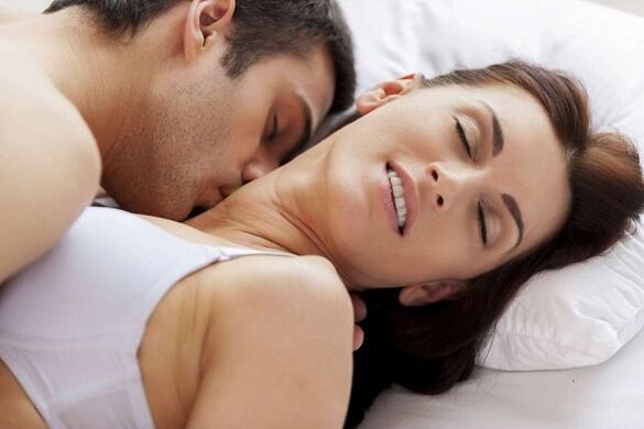 The excited man and woman in bed